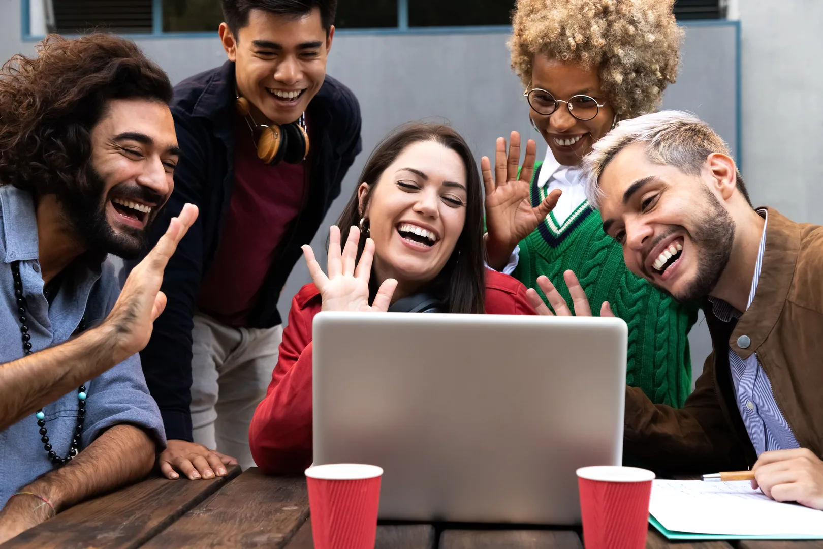 Smiling multiracial group of friends on a video call together