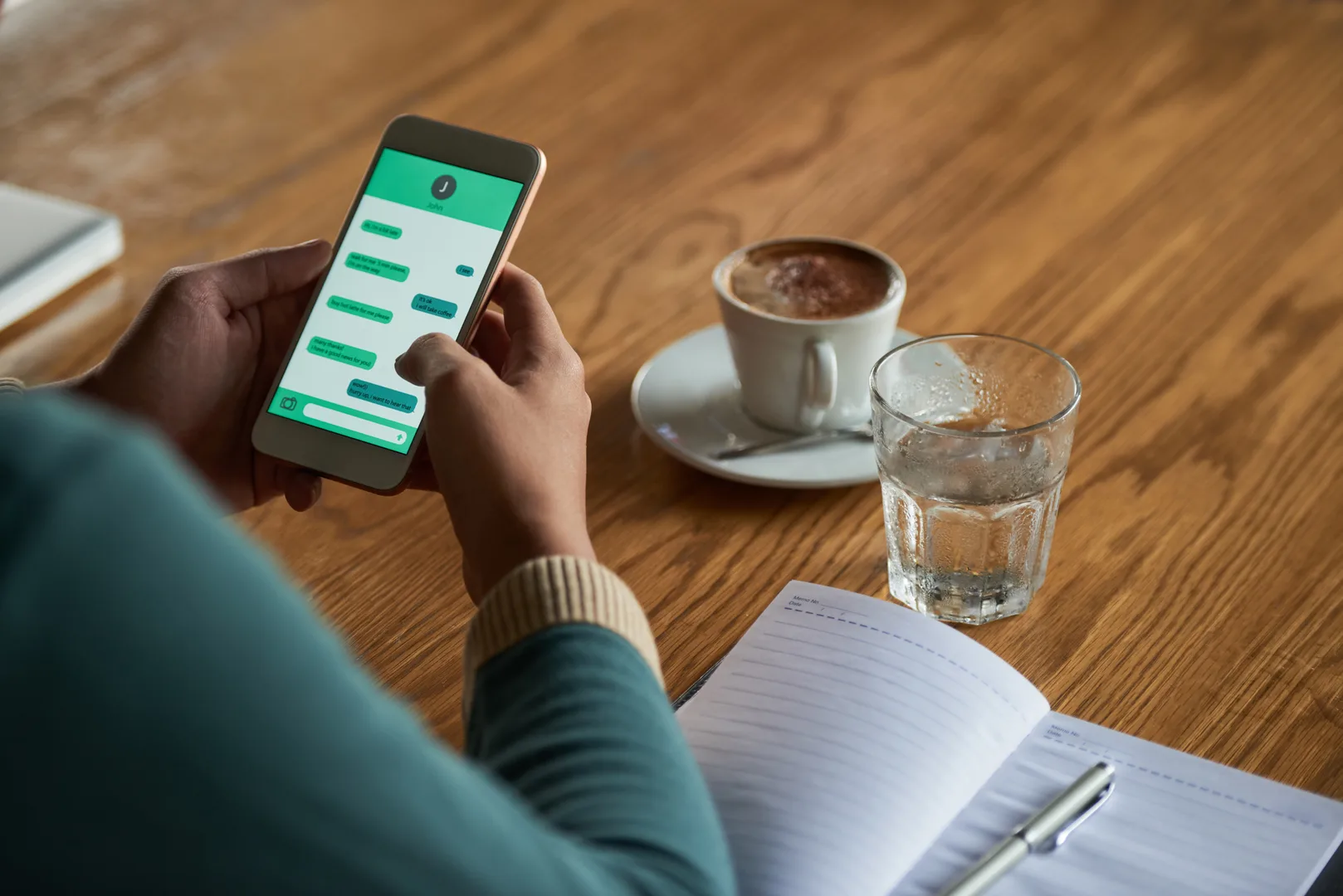 Person checking messenger app on smartphone